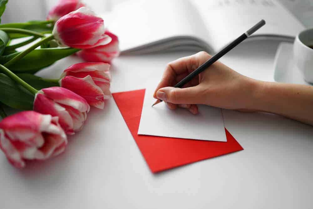 woman writing a love letter for husband