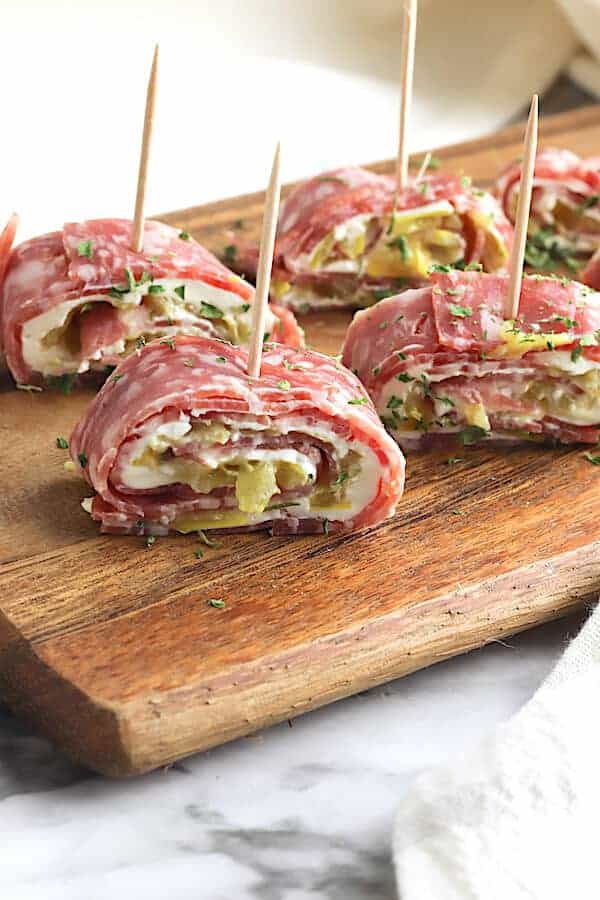 salami pinwheels on a cutting board