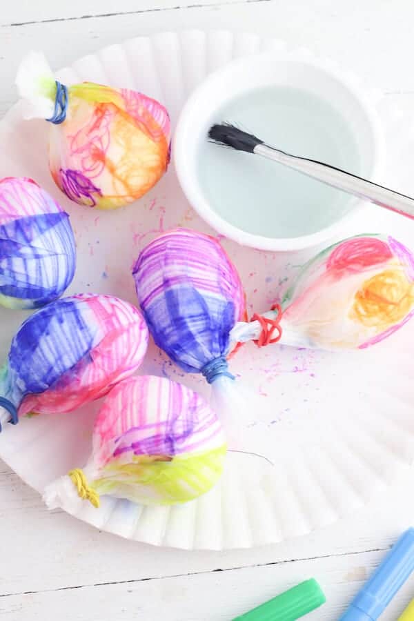 marker colored coffee filters around Easter eggs
