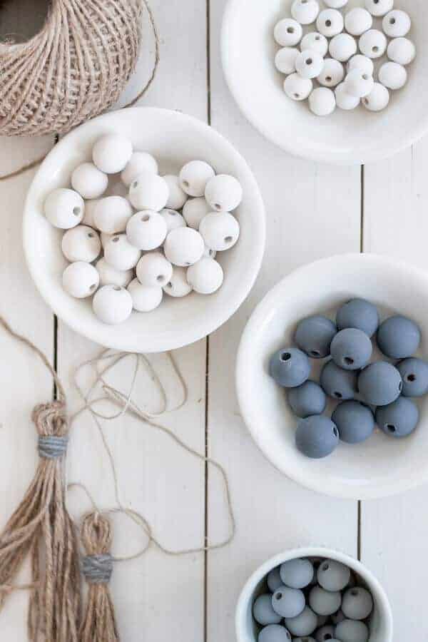 painted wood beads and a jute tassel to make a garland