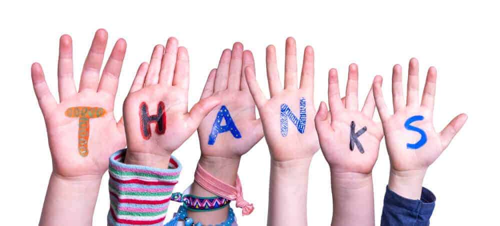 "Thanks" written on kids hands