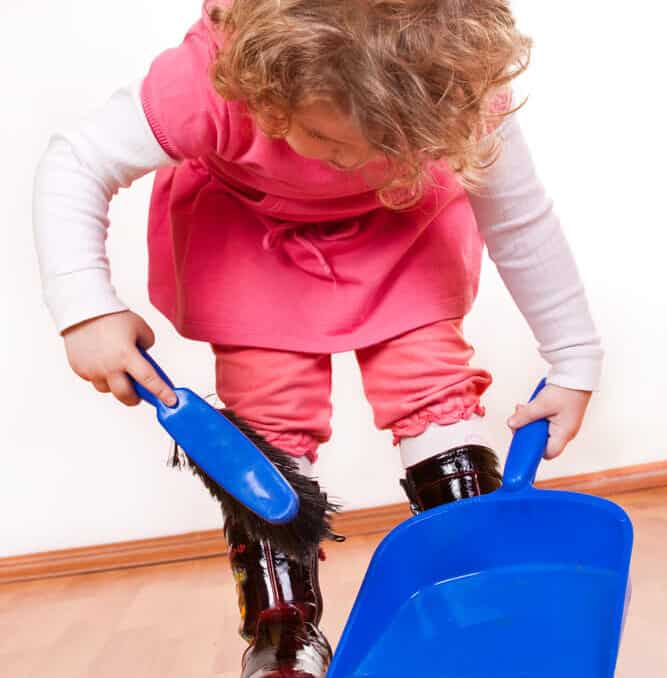 little girl doing chores