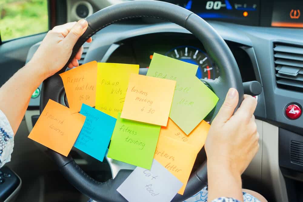 to do list sticky notes on a steering wheel