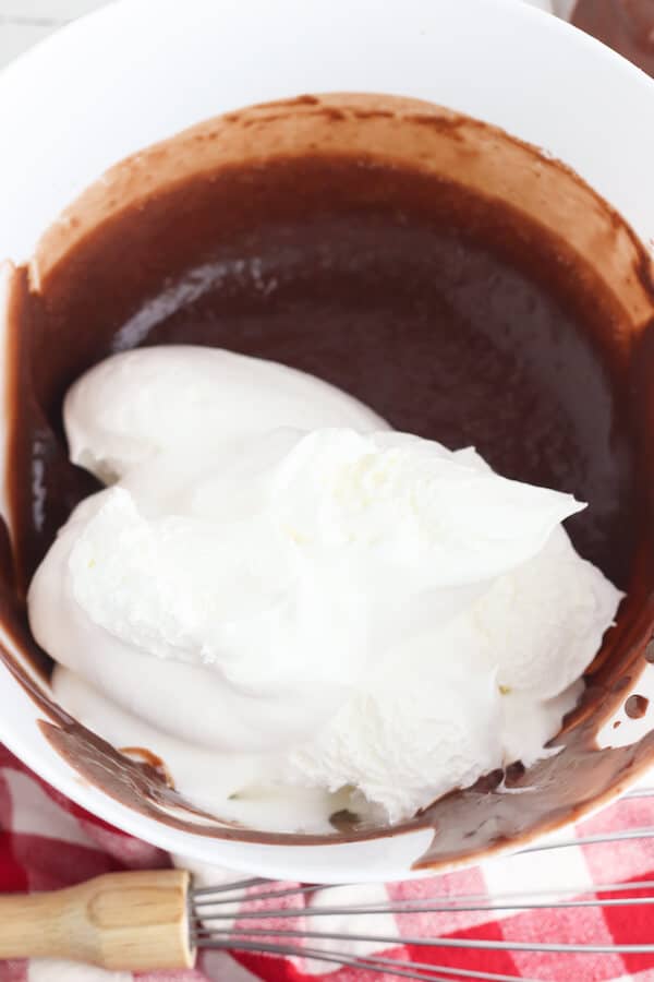 chocolate pudding and cool whip in a mixing bowl