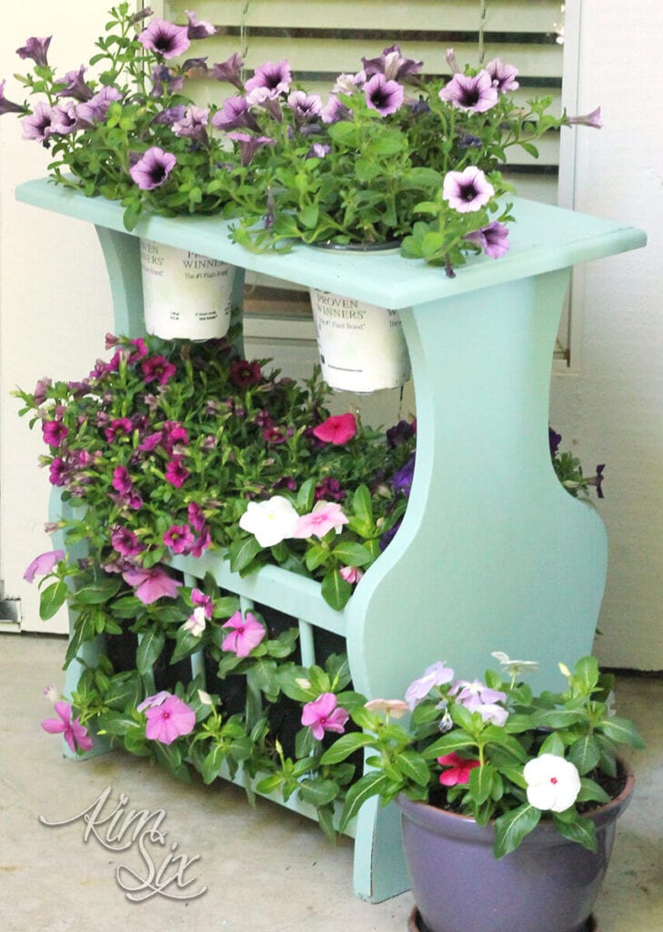 magazine rack repurposed into a plant stand