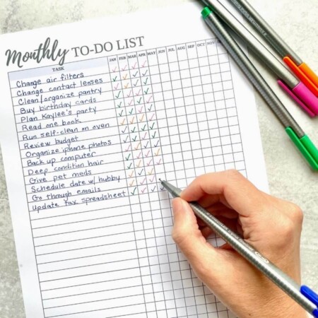 woman writing a monthly to do list