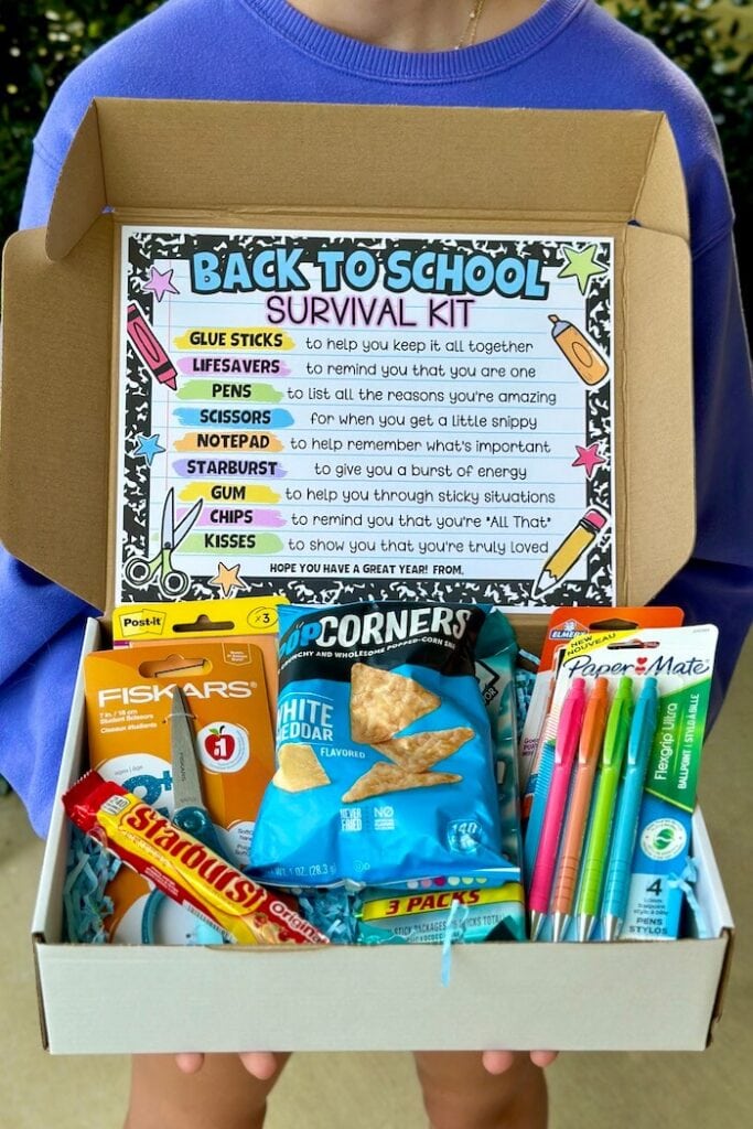 a survival kit for teachers with snacks, candy, and office supplies