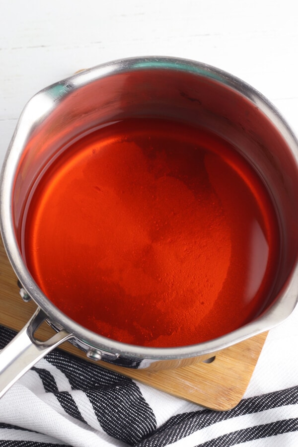orange gelatin mixture in a pot