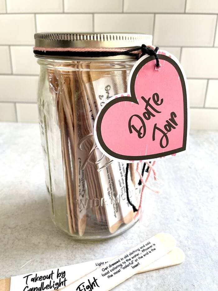 date night ideas jar with large craft sticks and a heart tag