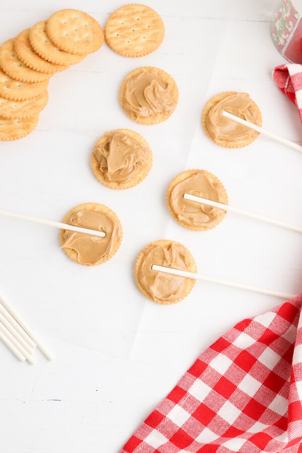 peanut butter spread on Ritz crackers