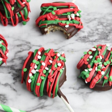 chocolate ritz cracker cookies decorated with red and green sprinkles