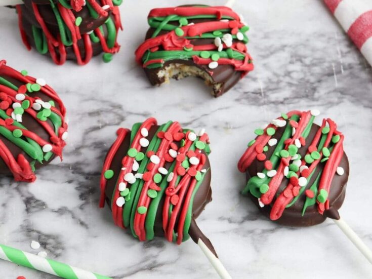 chocolate ritz cracker cookies decorated with red and green sprinkles