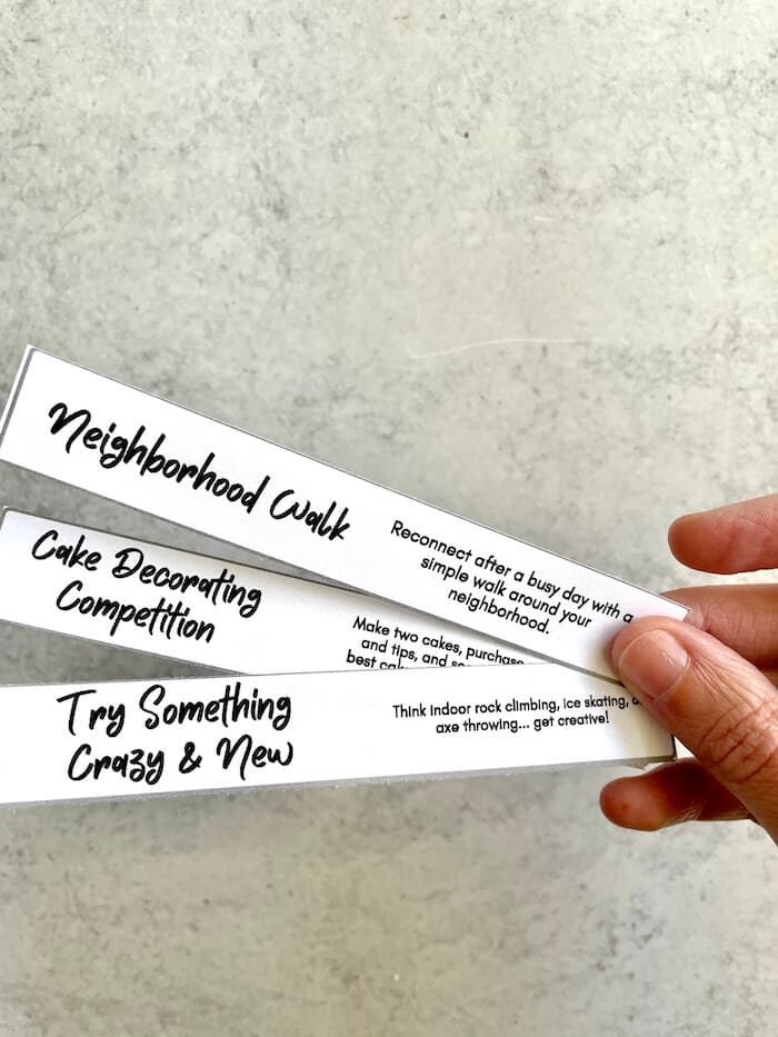slips of paper with date night ideas on them
