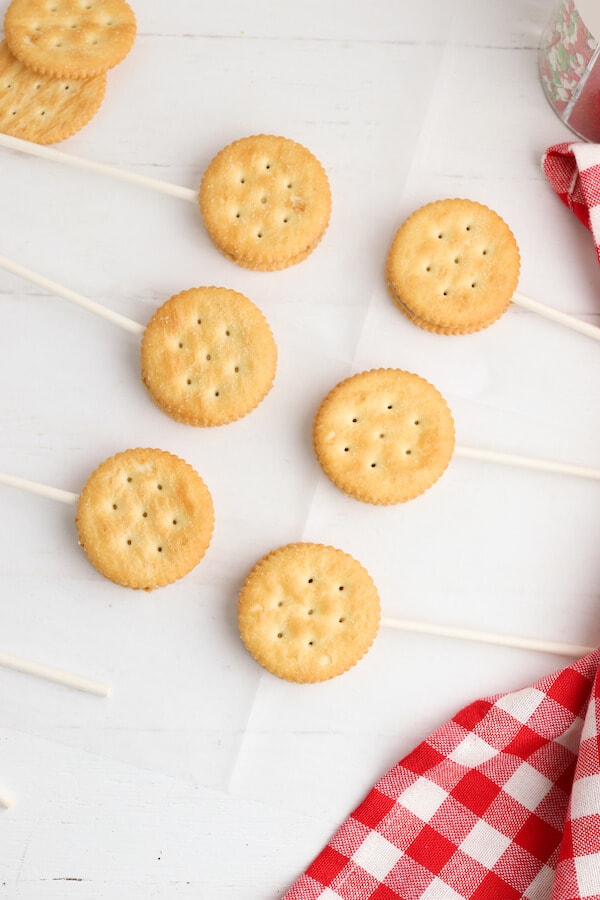 ritz crackers and peanut butter sandwiches on lollipop sticks