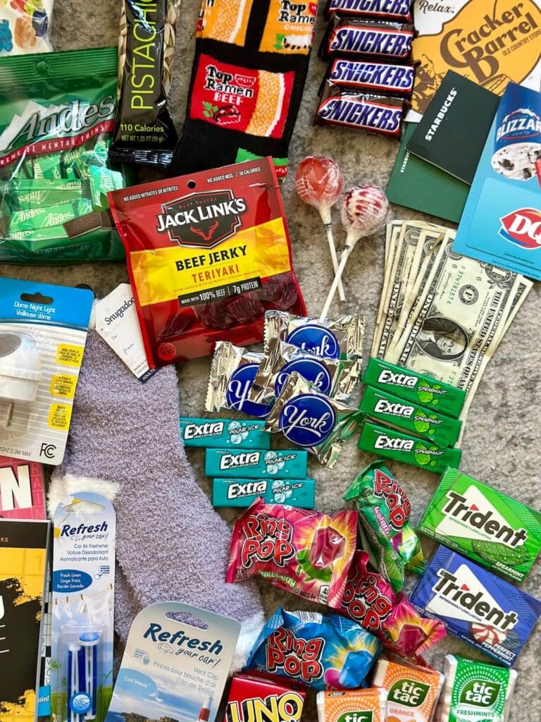 Saran wrap ball game prizes like gum, mini candy bars, and dollar bills