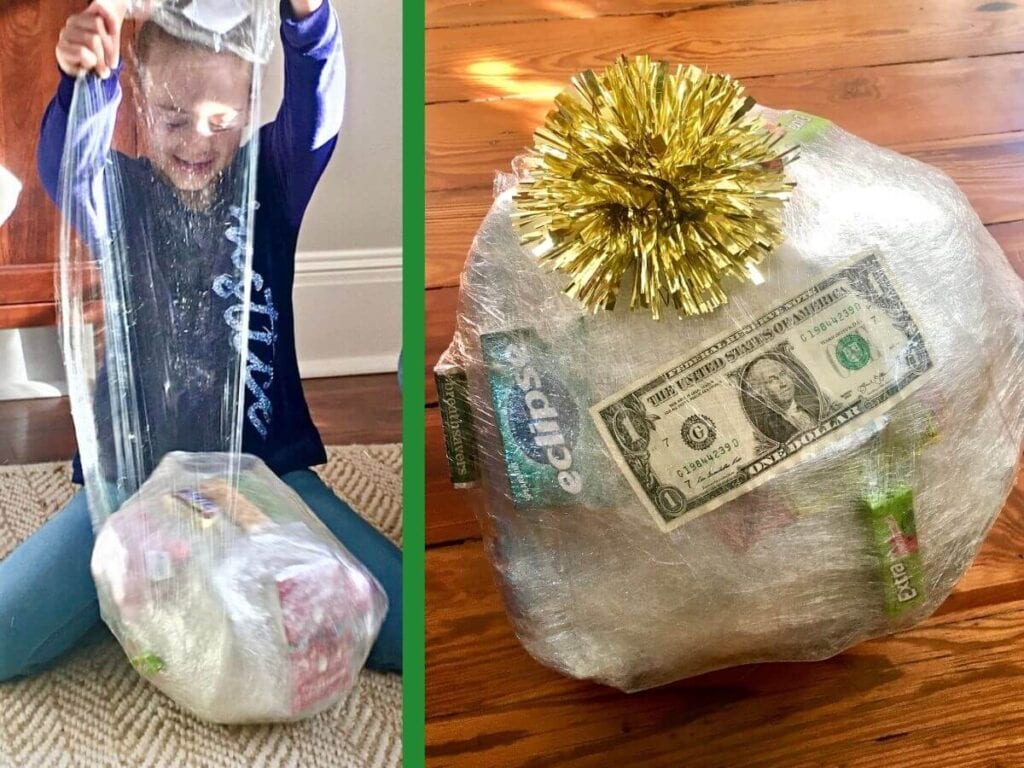 saran wrap ball game and girl unwrapping plastic ball with prizes inside