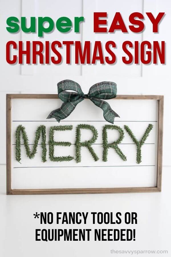 DIY wooden Christmas sign with faux shiplap and "Merry" written on it in pine stems
