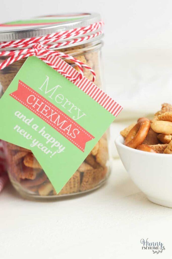 Chex mix in a mason jar with a gift tag