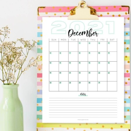 printable December calendar on a clipboard