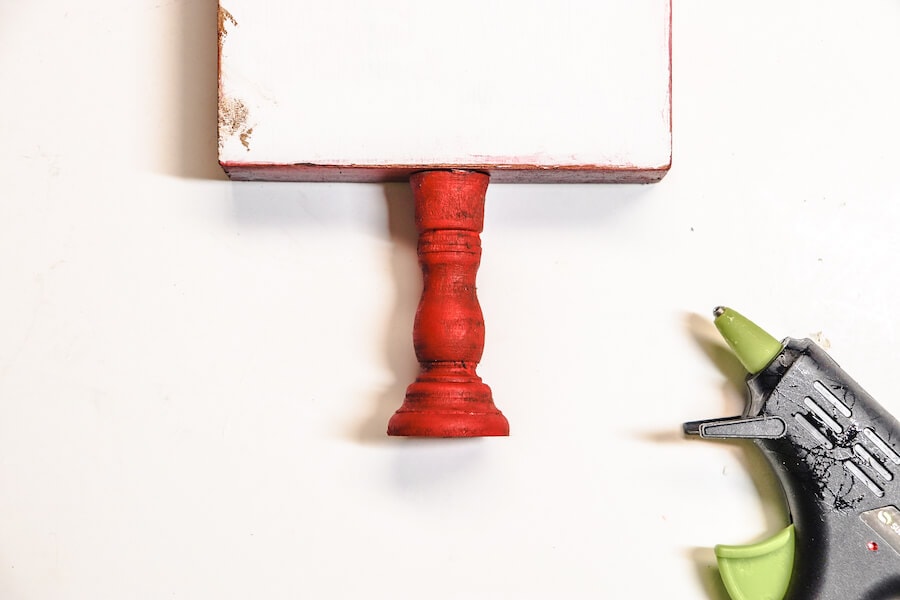 gluing candlestick to bottom of painted wood table sign