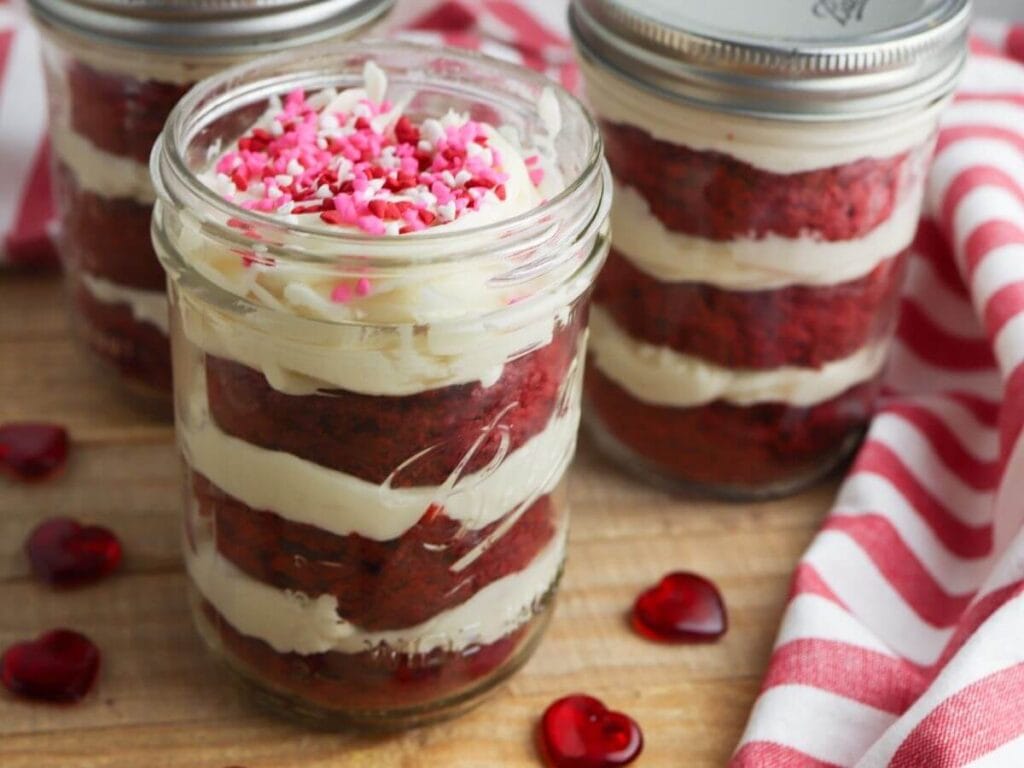 red velvet cake in a jar on a cutting board