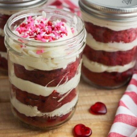 red velvet cake in a jar on a cutting board