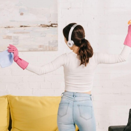 woman getting motivated to clean listening to music