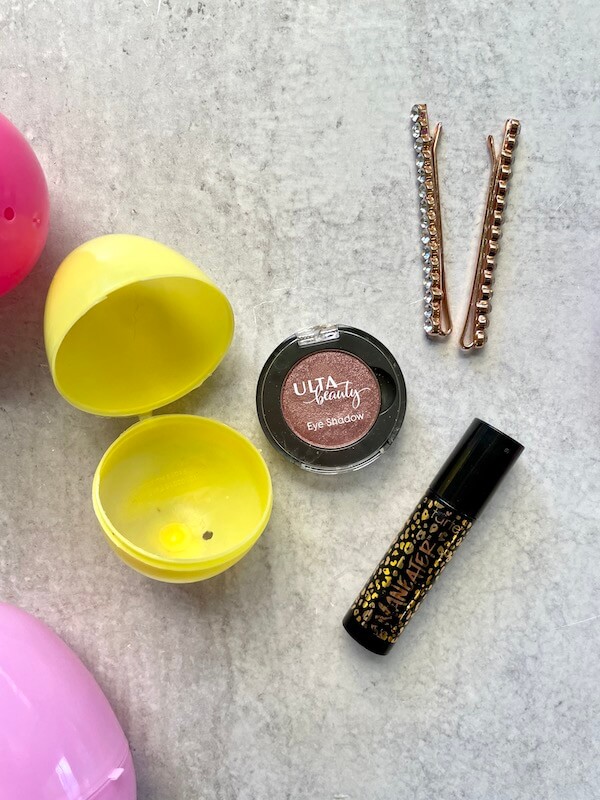 small beauty products and plastic easter eggs