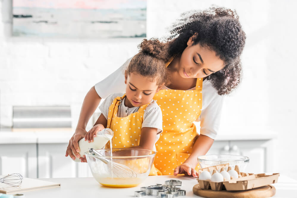 mother and daughter cooking together