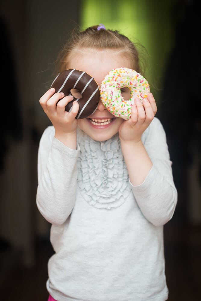 girl with two donuts