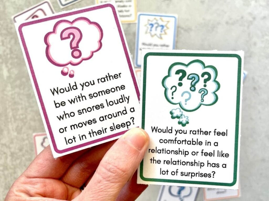 two printable cards with would you rather questions for couples