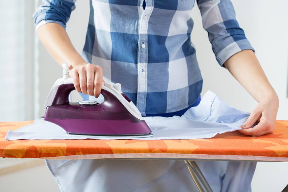 woman ironing her husband's shirt