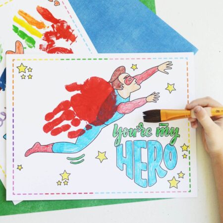 child making Father's Day handprint art with printable templates