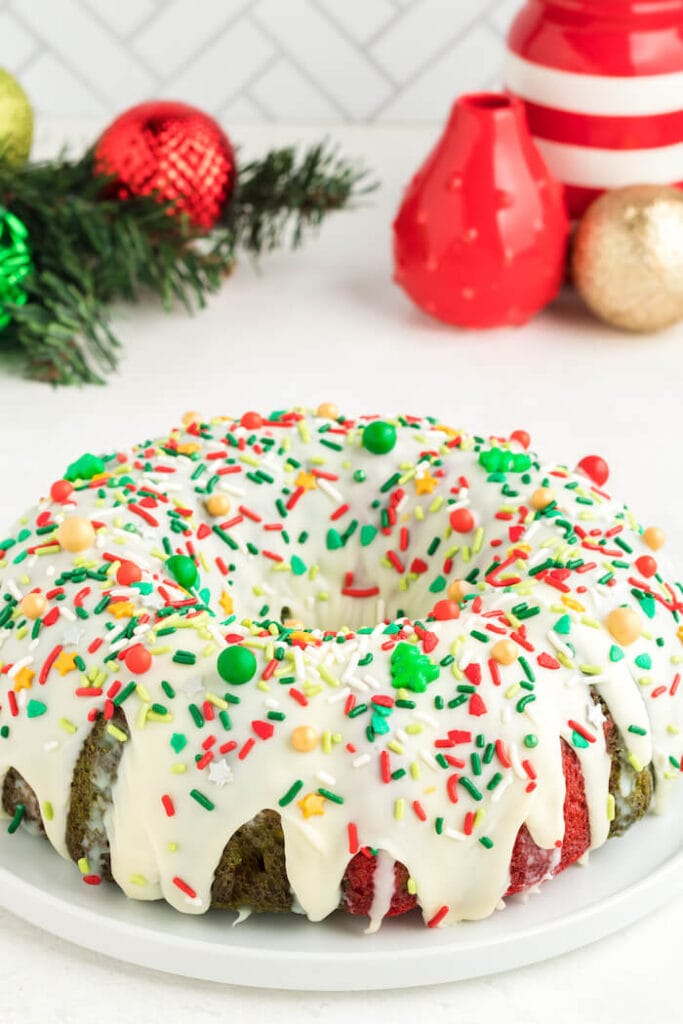 Christmas bundt cake decorated with ganache and holiday sprinkles