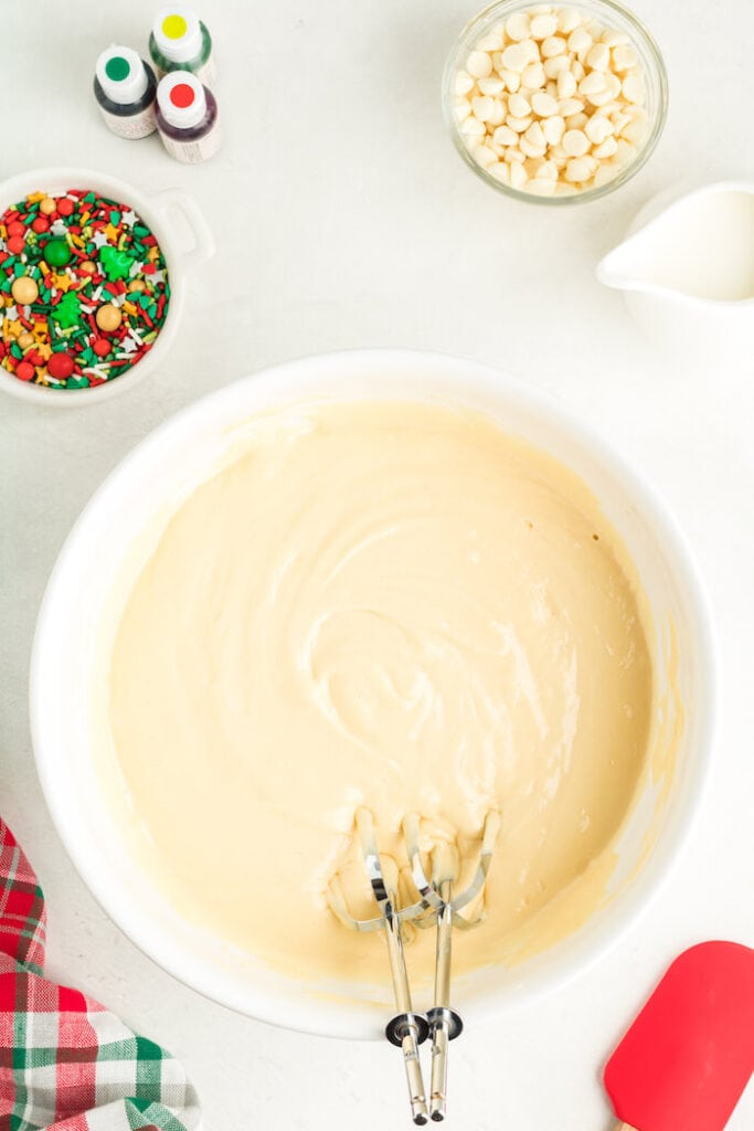 white cake batter mixed in a bowl