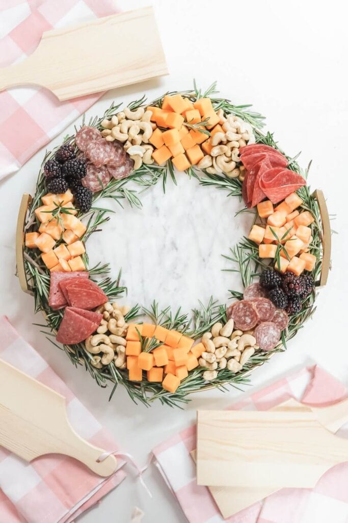charcuterie ingredients arranged in a Christmas wreath shape