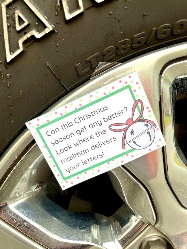 Christmas treasure hunt rhyming clue card taped to a car tire