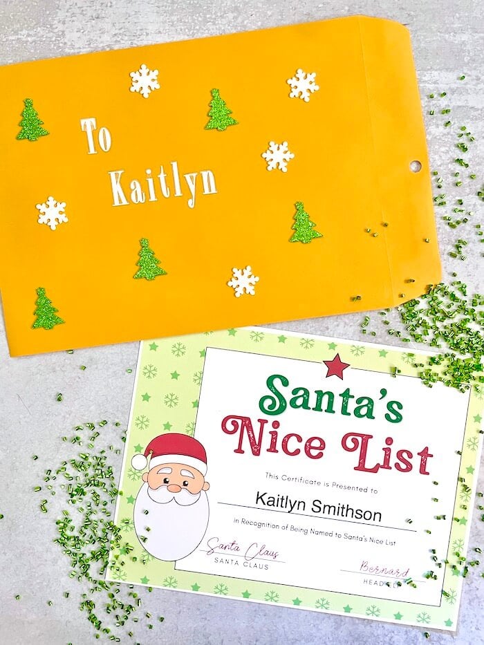 Santa's nice list certificate with a mailing envelope and confetti