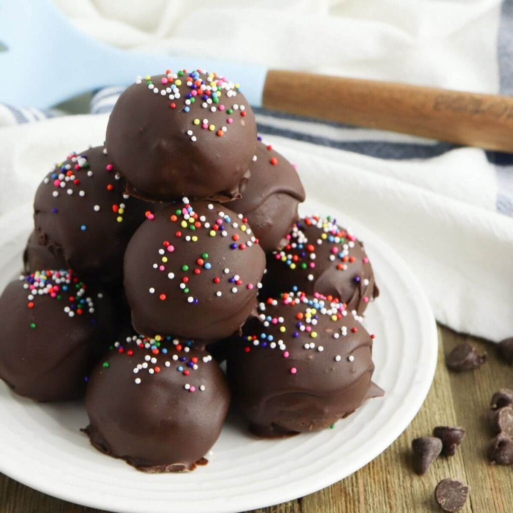 brownie truffles stacked up on a plate