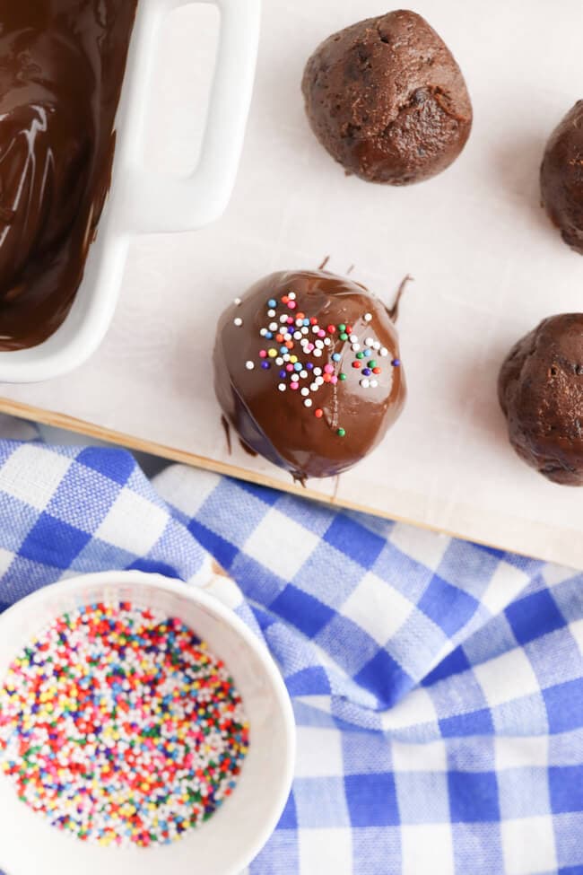 decorating brownie truffles with sprinkles