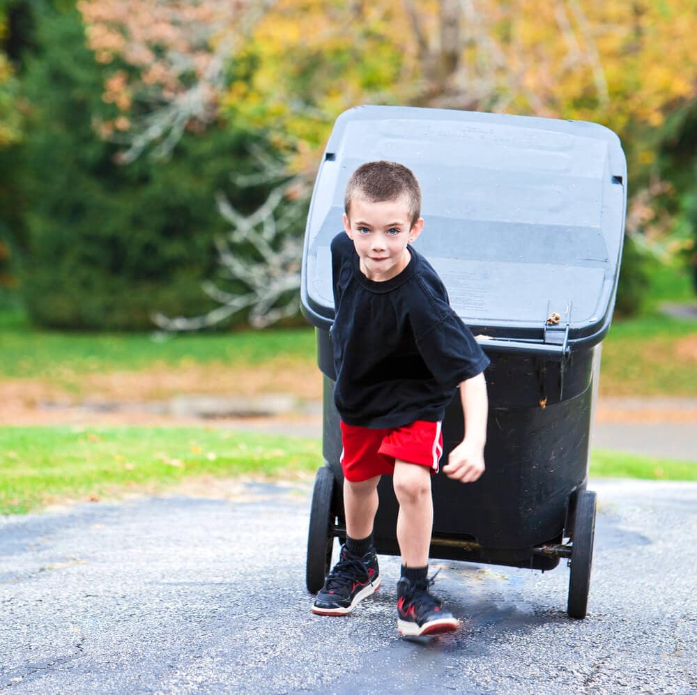 boy taking out the garbage