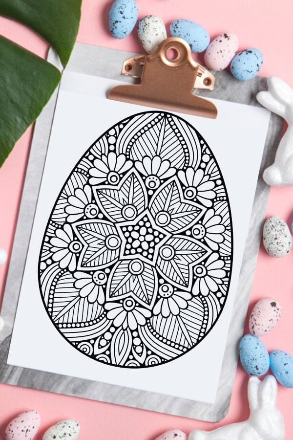 Easter egg mandala coloring page on a clipboard
