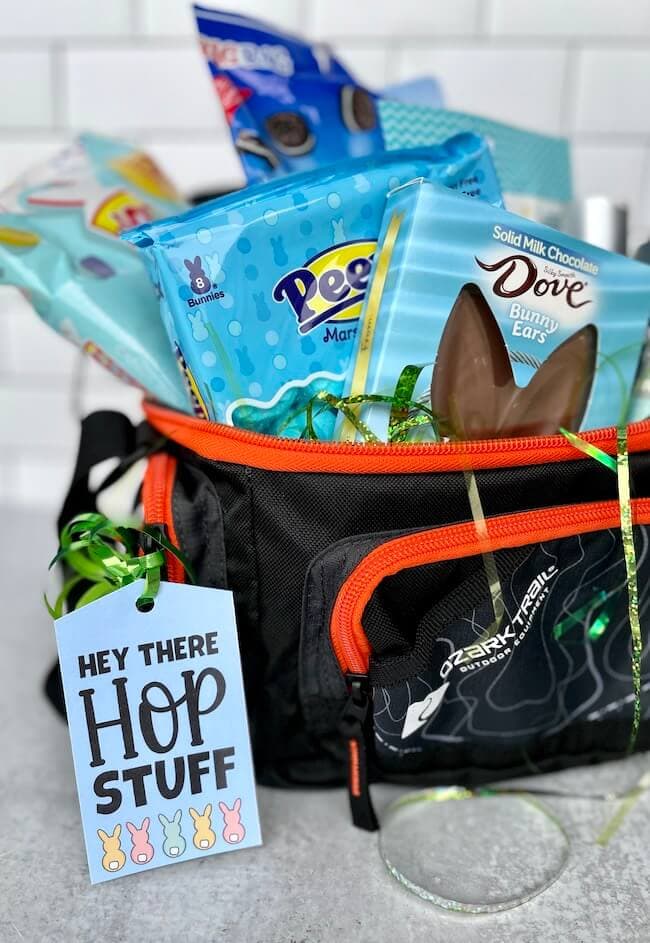 man's Easter basket with a gift tag that says hey there hop stuff