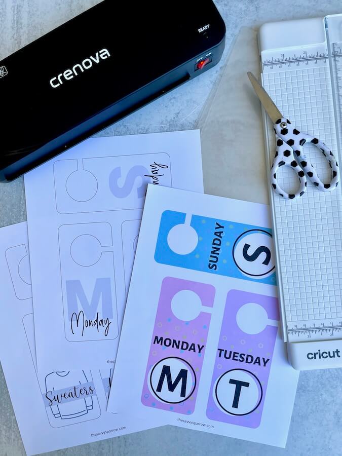 printable closet hanger tags with days of the week, laminator, paper trimmer and scissors