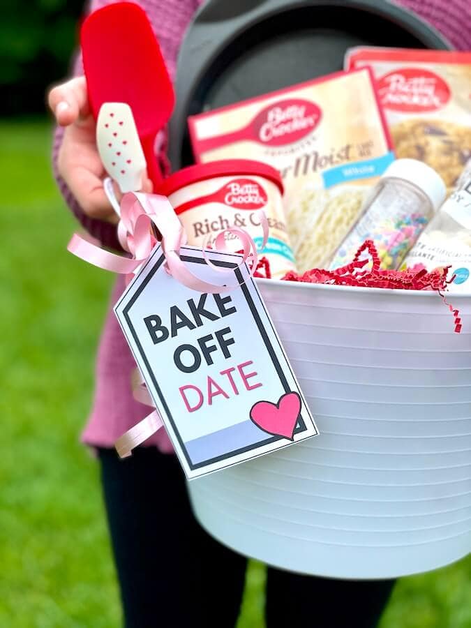 date night gift basket with baking supplies and a tag that says bake off date