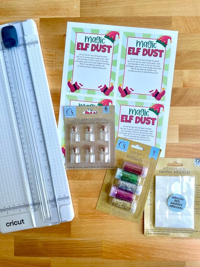 paper trimmer, glitter, plastic mini bottles, and magic elf dust PDF