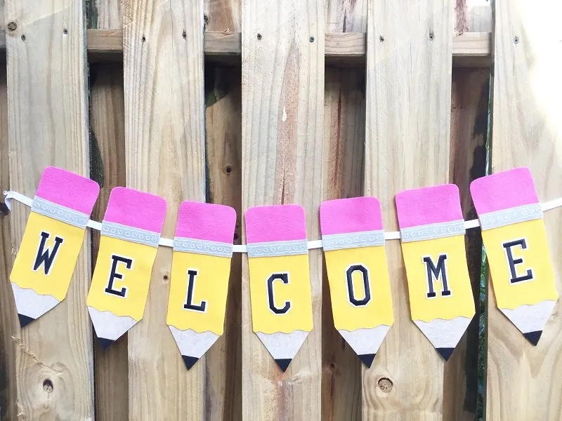 Welcome banner with pencils
