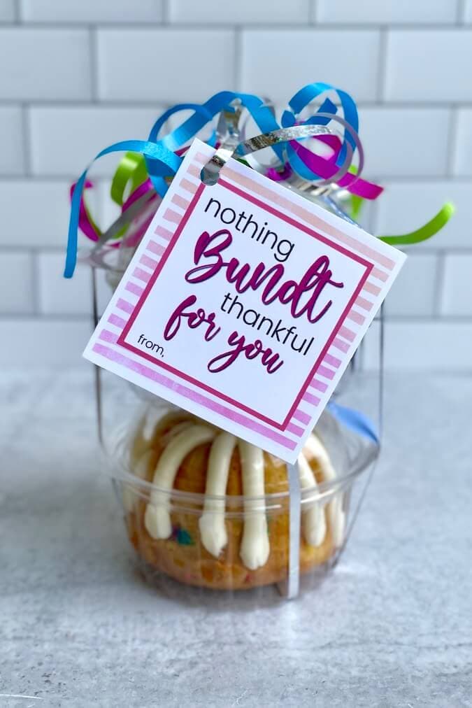 two nothing bundt cakes stacked up with a free printable gift tag