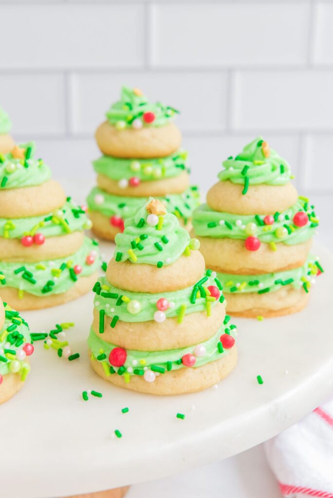 iced sugar cookies stacked up to look like Christmas trees