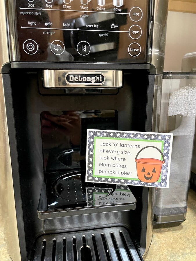 a Halloween scavenger hunt clue on a coffee maker